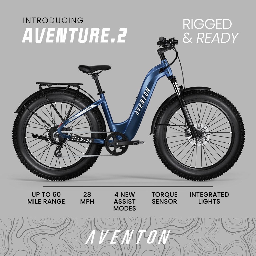 A blue bicycle is sitting on a gray background.