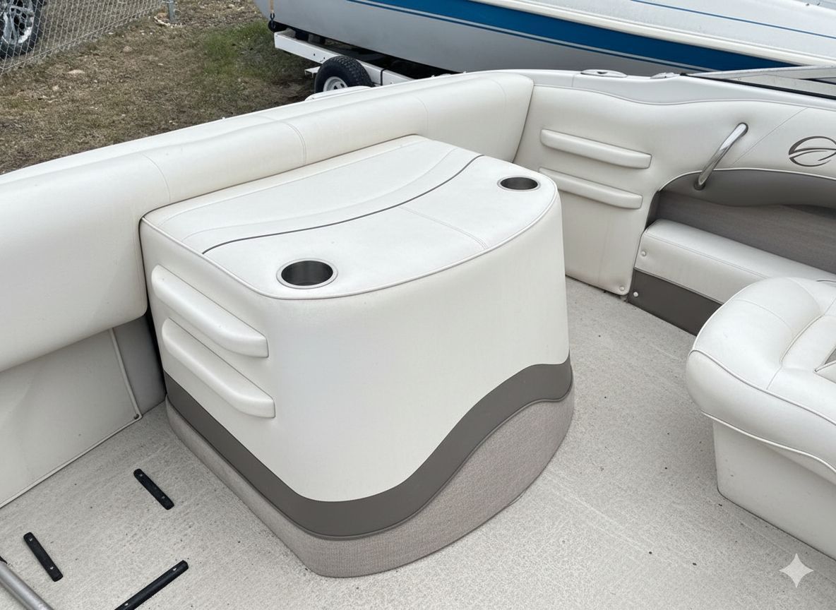 White boat seating area with a central cooler-style seat and built-in cup holders