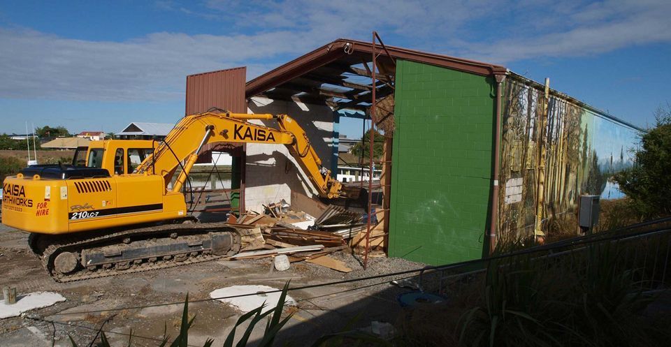 A yellow excavator with the word kaisa on it A yellow excavator with the word kaisa on it