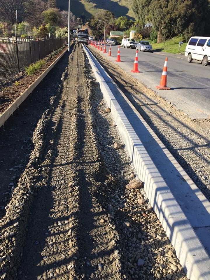 Three asphalt rollers are working on a road under construction. Three asphalt rollers are working on a road under construction.