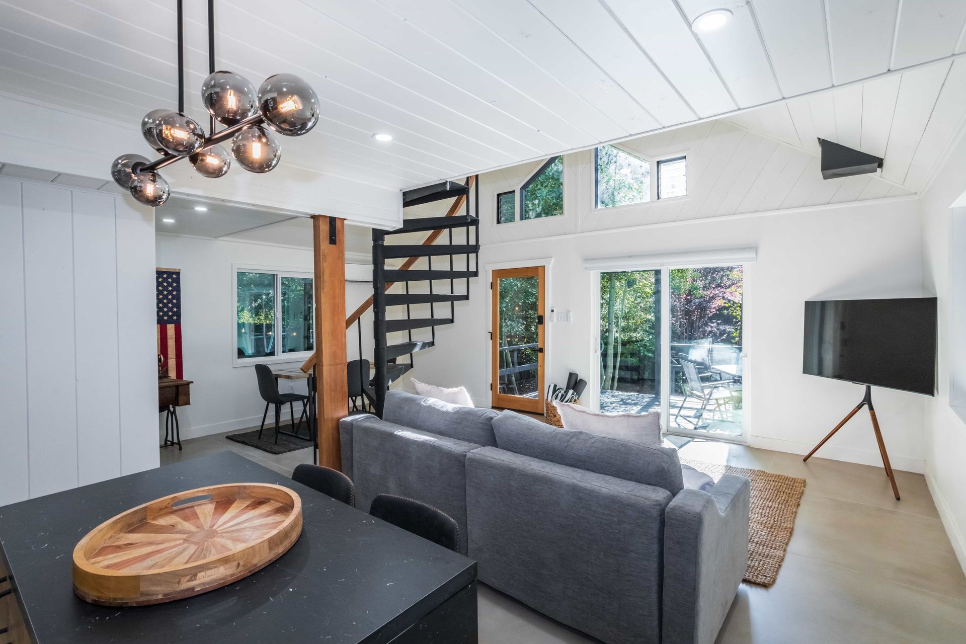 A living room with a couch , table , and television.