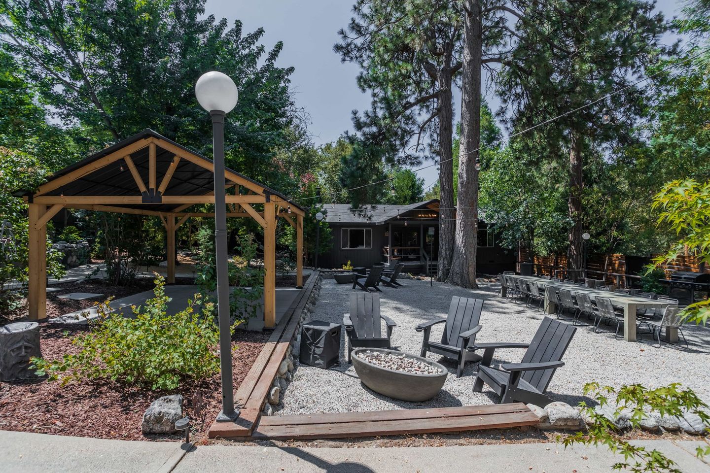 There is a fire pit in the middle of the yard.