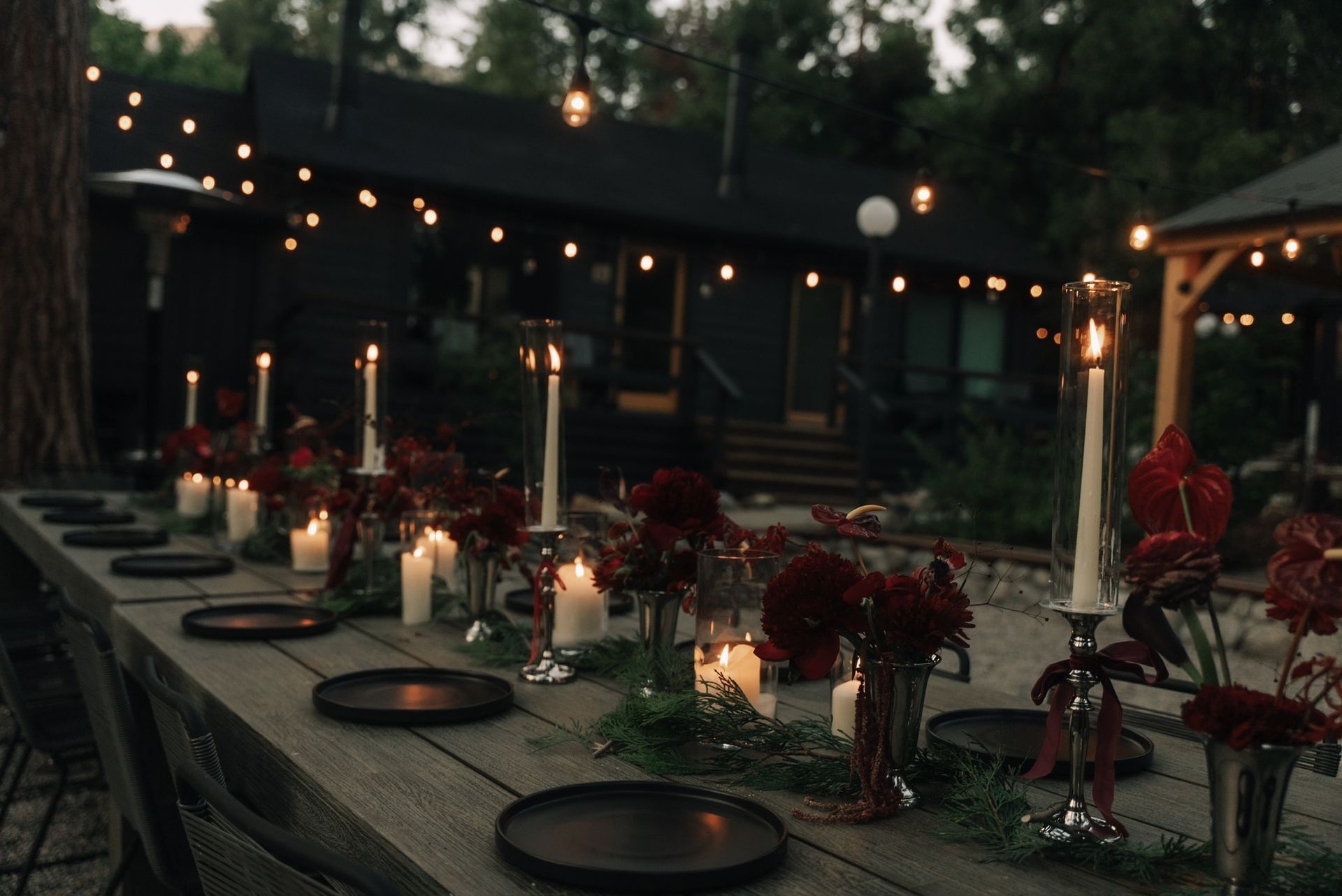 Rustic wedding reception setup with string lights and decor