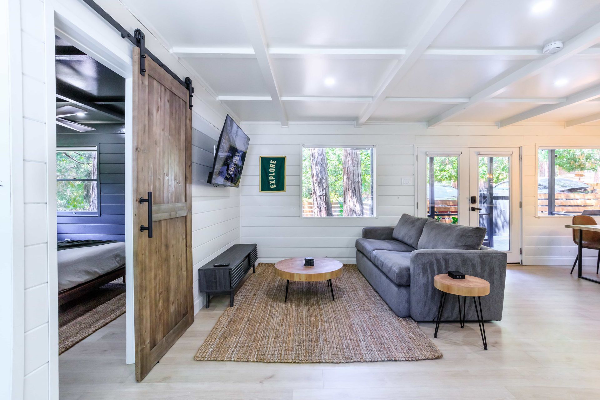 A living room with a couch , table , and television.