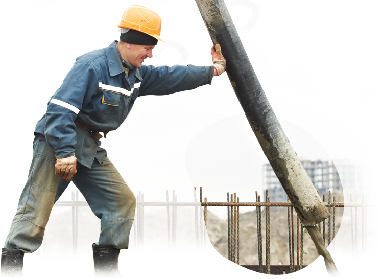 A man wearing a hard hat is holding a large pipe