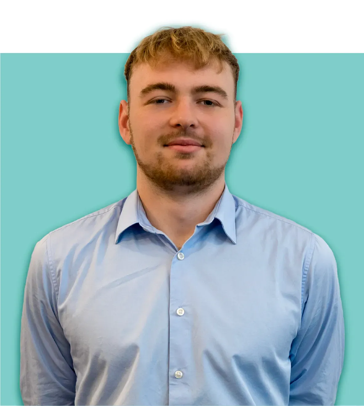 Young man with light skin wearing a blue button-down shirt, standing in front of a blue-green background.