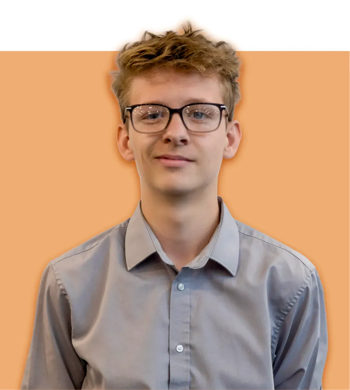 Young person with glasses, light grey button-up shirt, smiles against an orange backdrop.