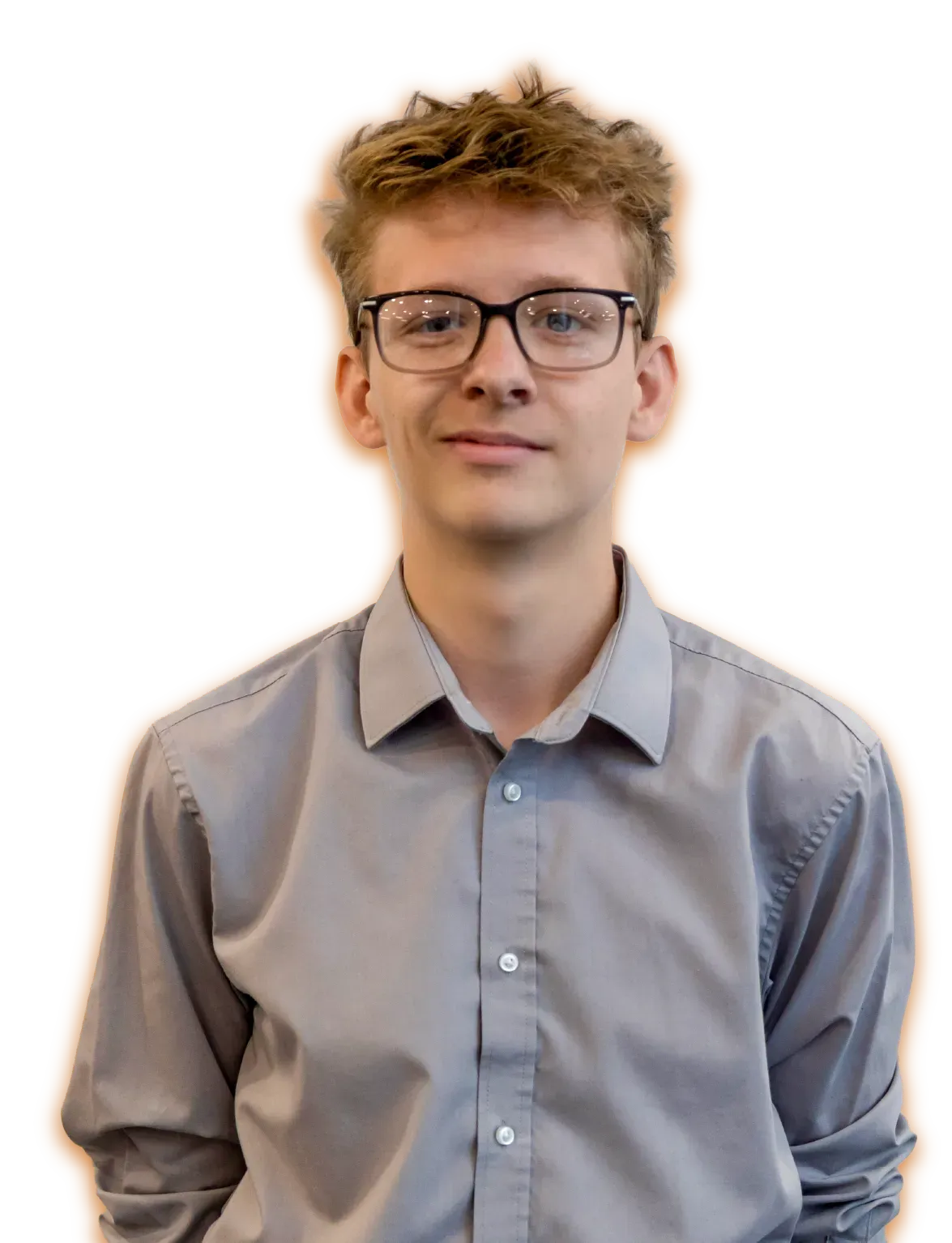 A woman in a striped jacket and black shirt is standing in front of a white background.