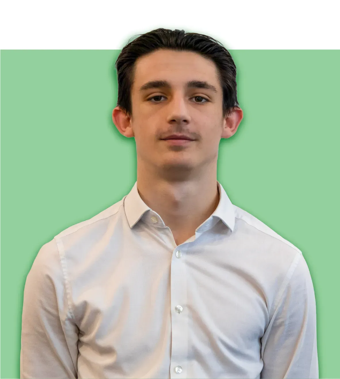Man in white shirt against a light green background.