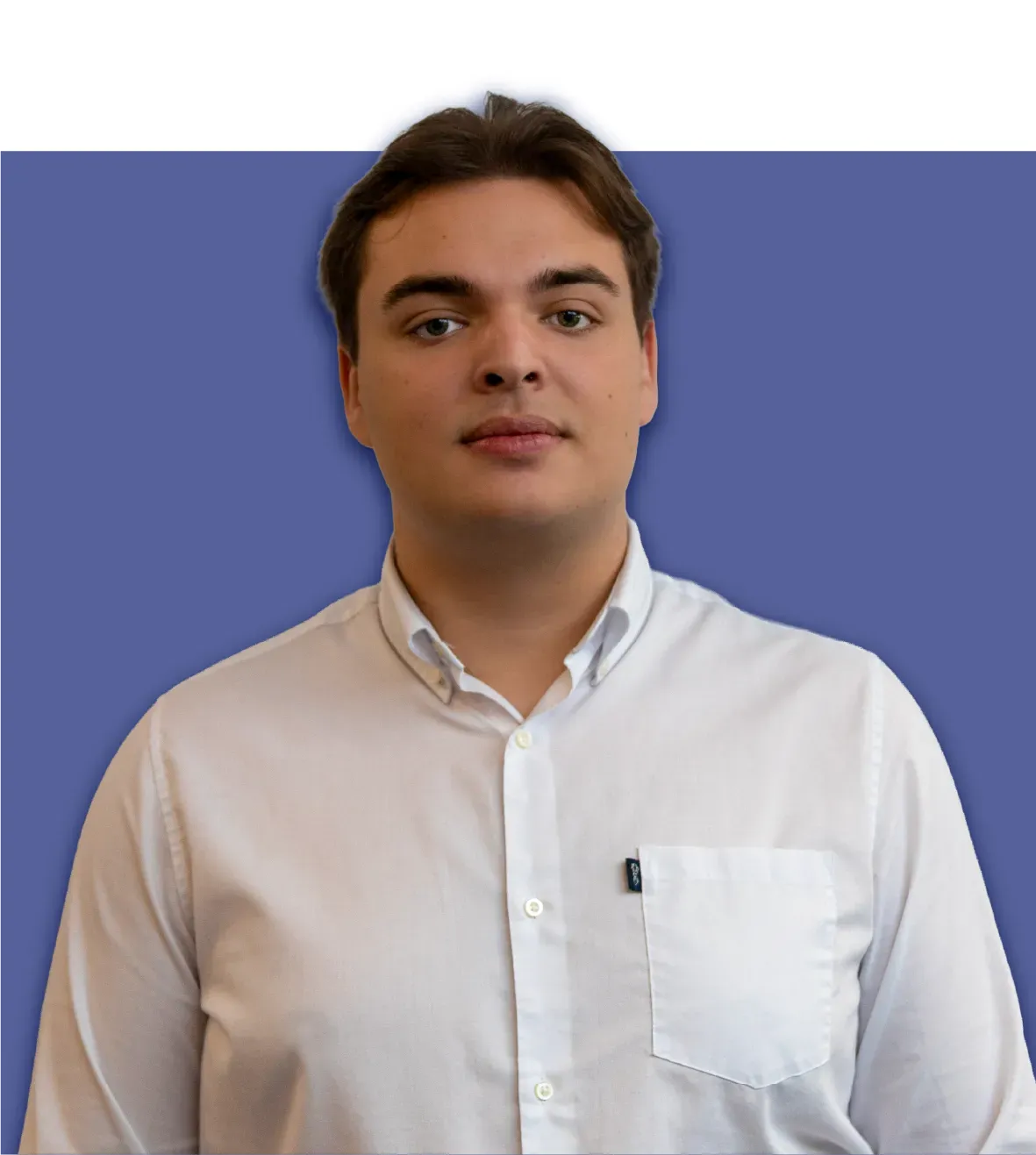 Man in white shirt against a blue background, looking forward.