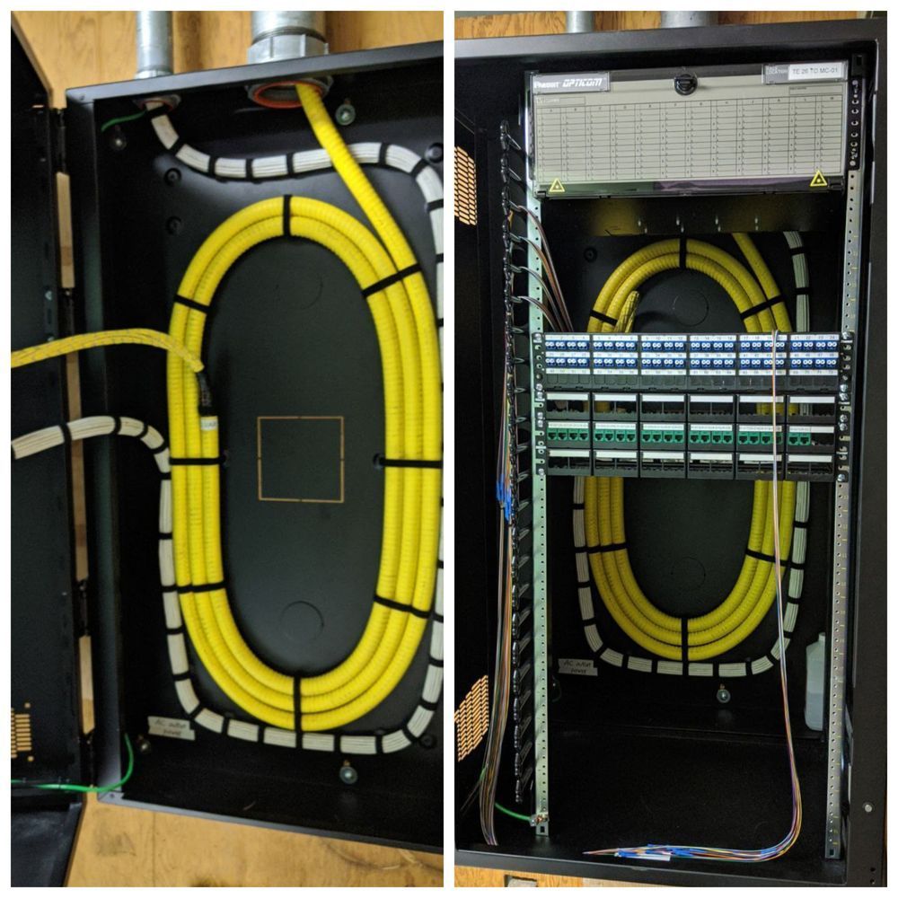 A black box with yellow wires inside of it