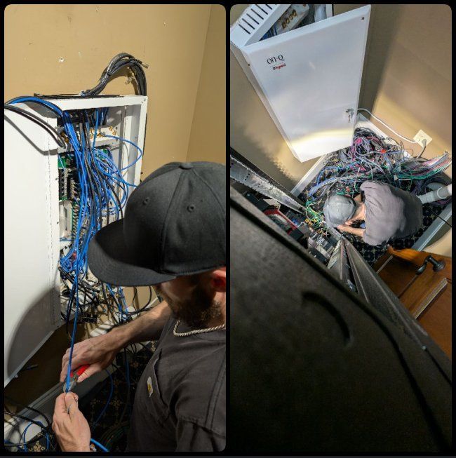 A man in a black hat is working on a computer