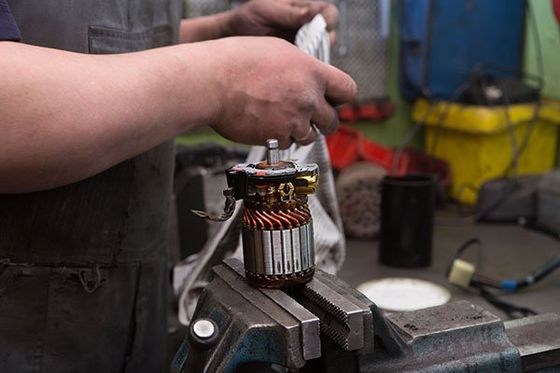 Mechanic repairing electric generator