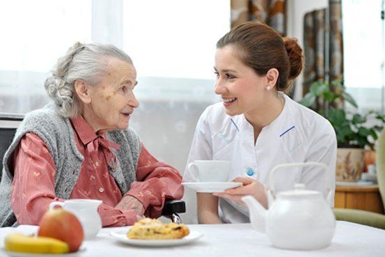 Senior Woman Eats Lunch — Uniontown, PA — Pento Homecare Agency