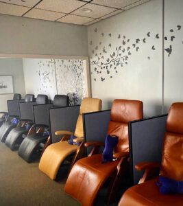 A row of chairs are lined up in a room