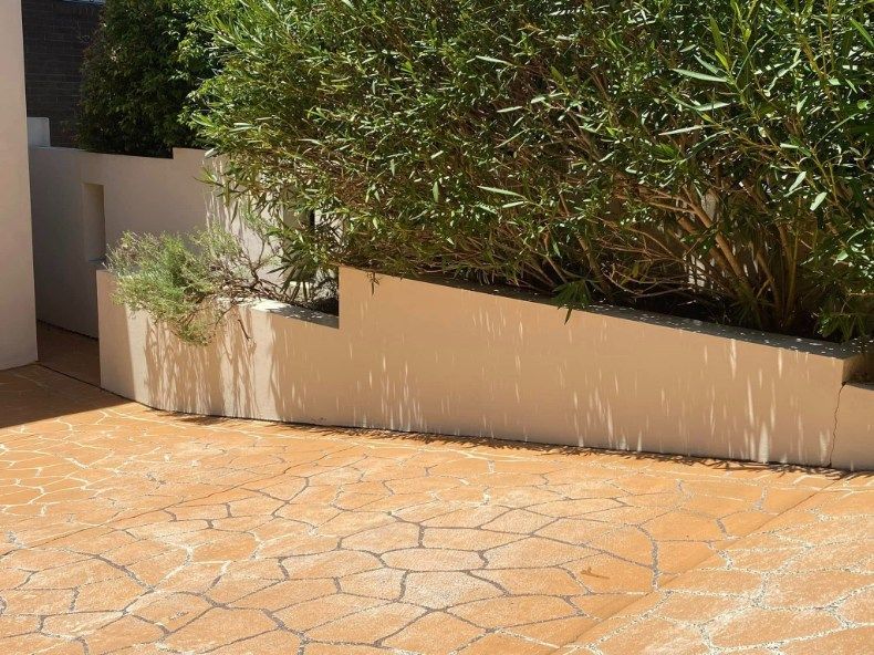A White House With A Covered Porch And A Window — The Guttering Cleaning Man in Forster, NSW