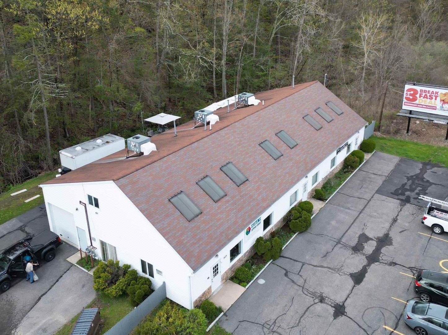 commercial shopping plaza with leaking roof and water damage in Torrington, ct