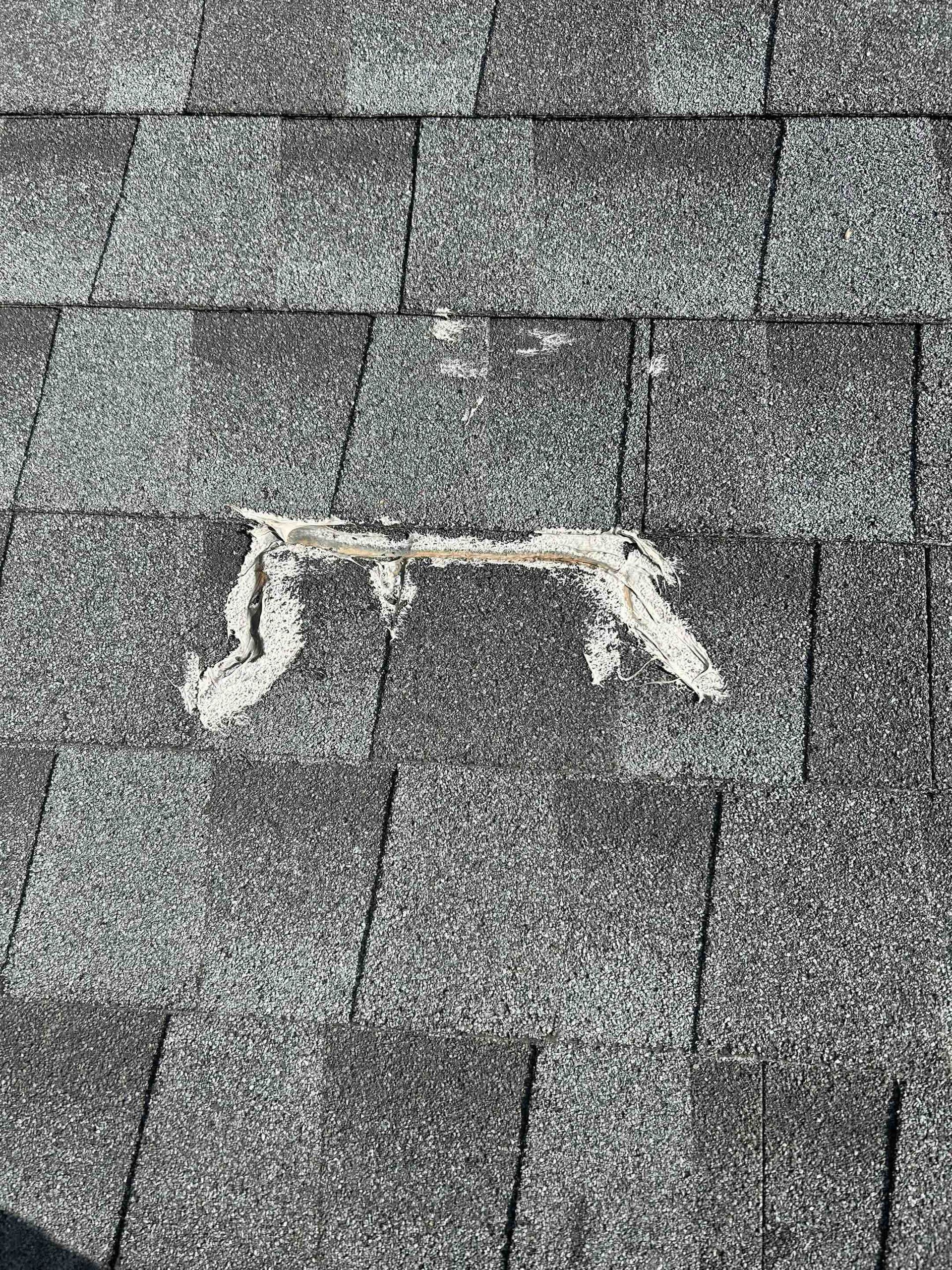 broken shingle that was repaired at some point