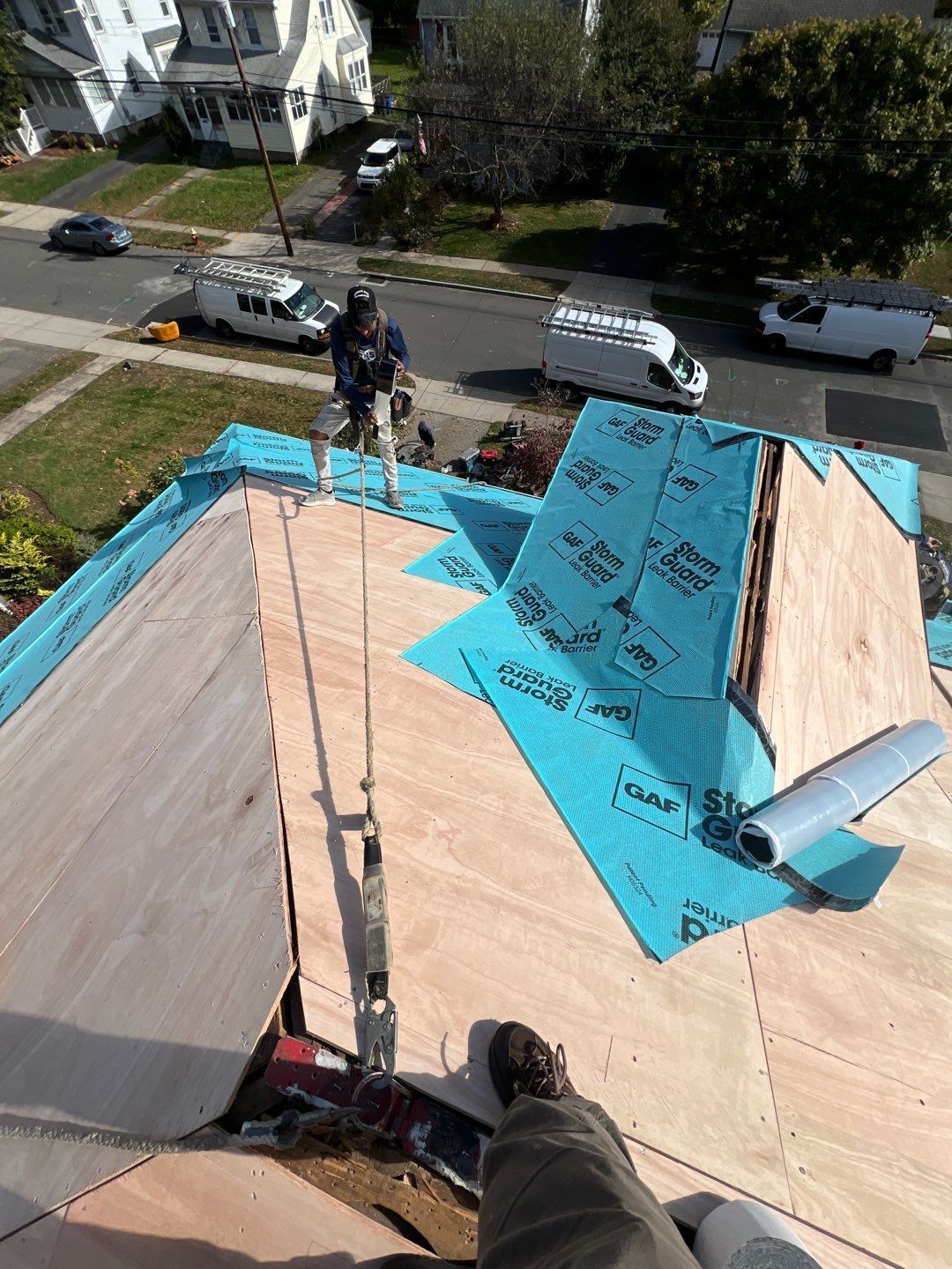 Professional Roofing Contractor in West Hartford installing new plywood decking and GAF Storm Guard Ice and Water