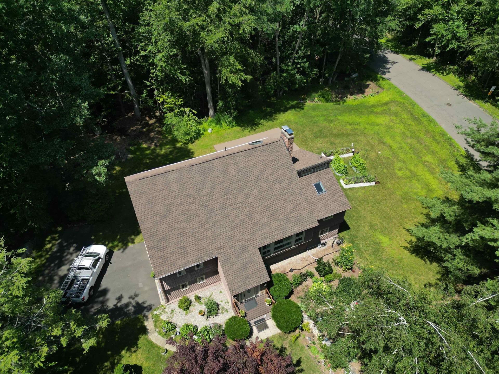drone photo of avon property with newly installed GAF roof and Velux skylights in Avon, CT
