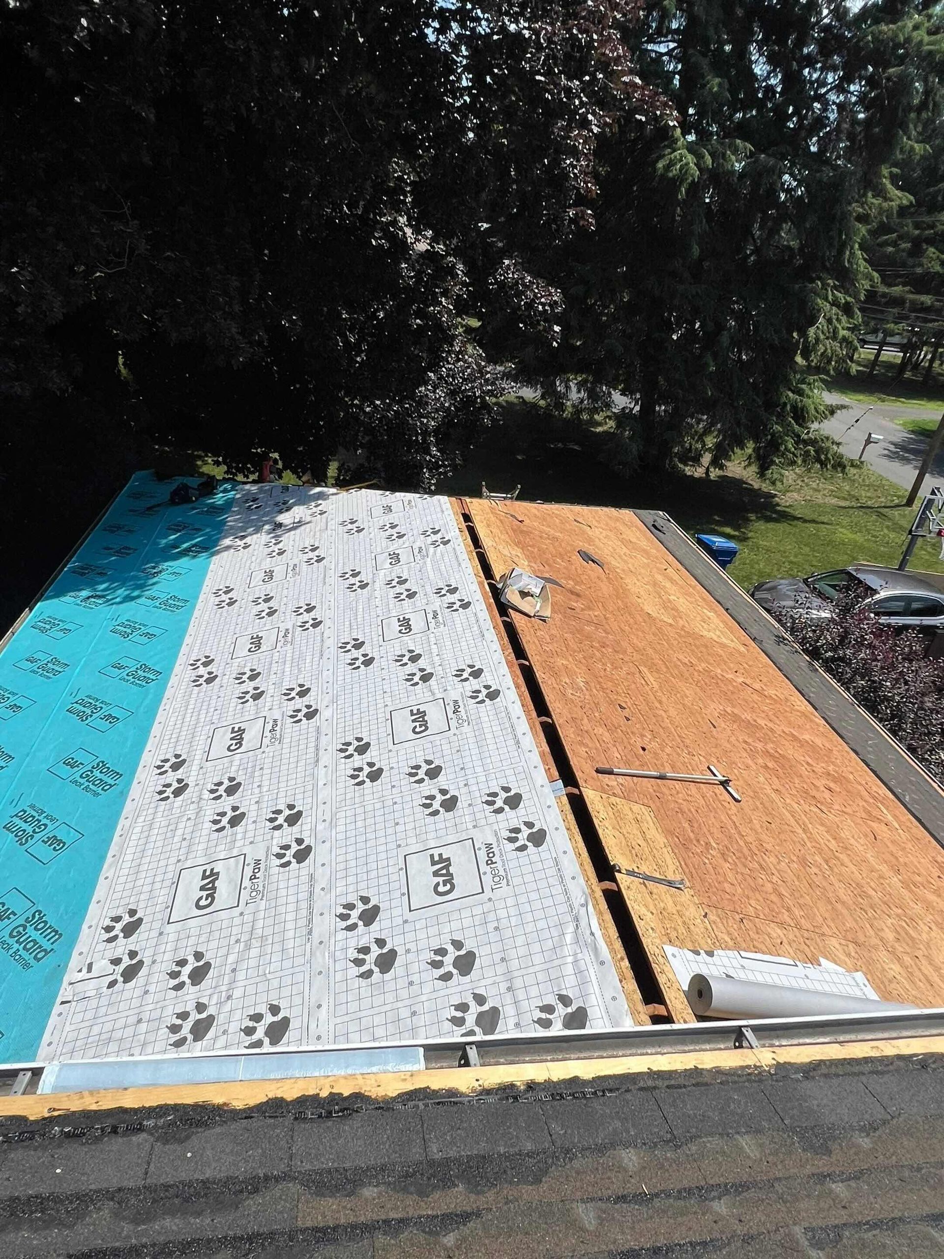 GAF ice and water and tiger paw water proofing on plywood during roofing job in Farmington, CT