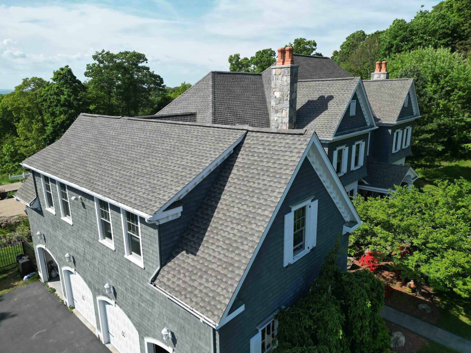 Newly Installed GAF Timberline HDZ Shakewood Roof with Copper Chimney Flashing & Valleys in West Hartford, CT