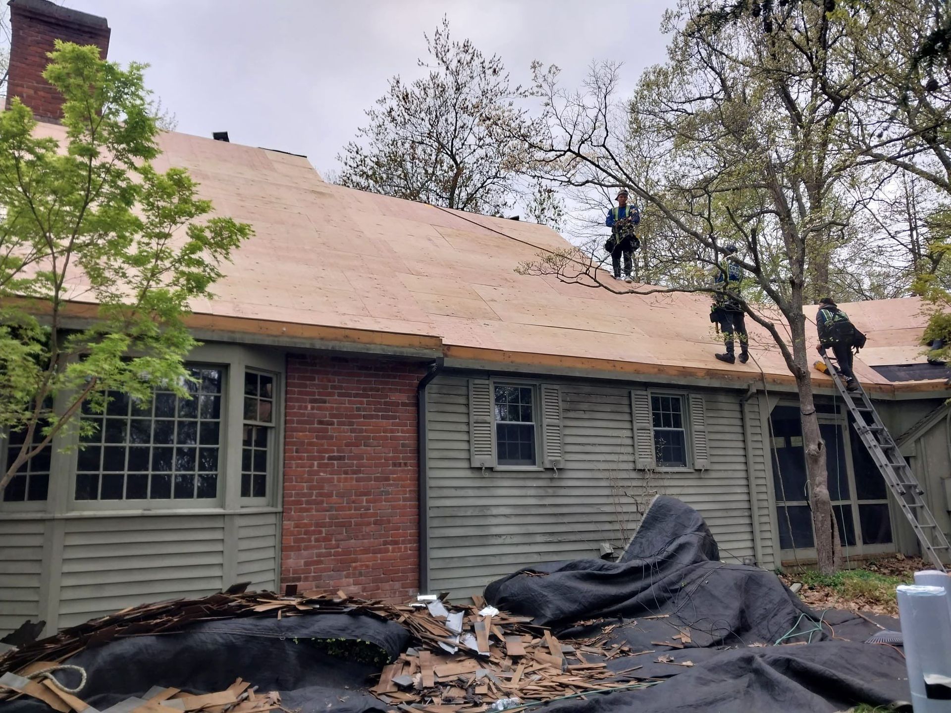 Roofing Crew Installing New Plywood in West Hartford, CT