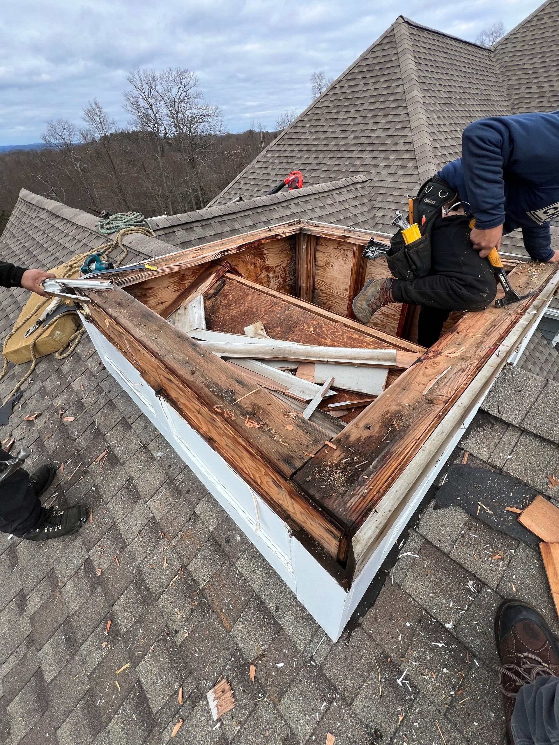 roofing crew dismantling old cupola 