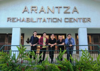 A group of people standing in front of the arantza rehabilitation center