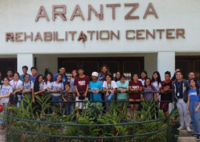A group of people standing in front of the arantza rehabilitation center