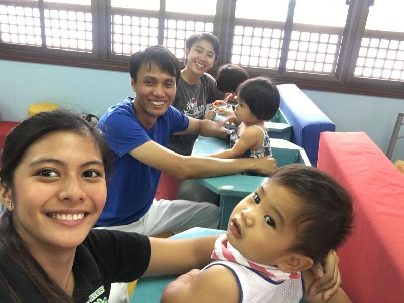 A group of people are posing for a picture with a baby