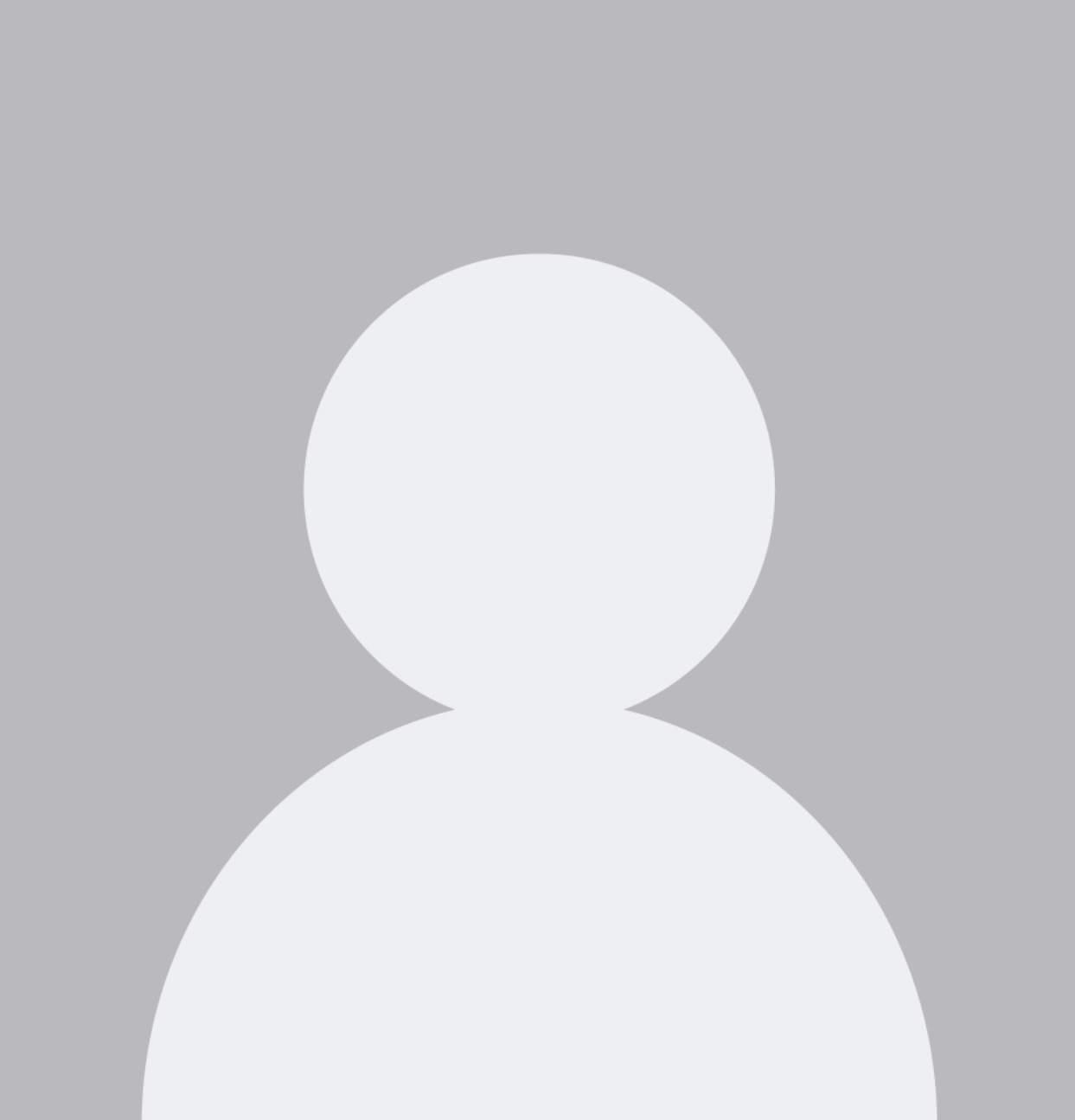 A silhouette of a person without a face on a gray background.