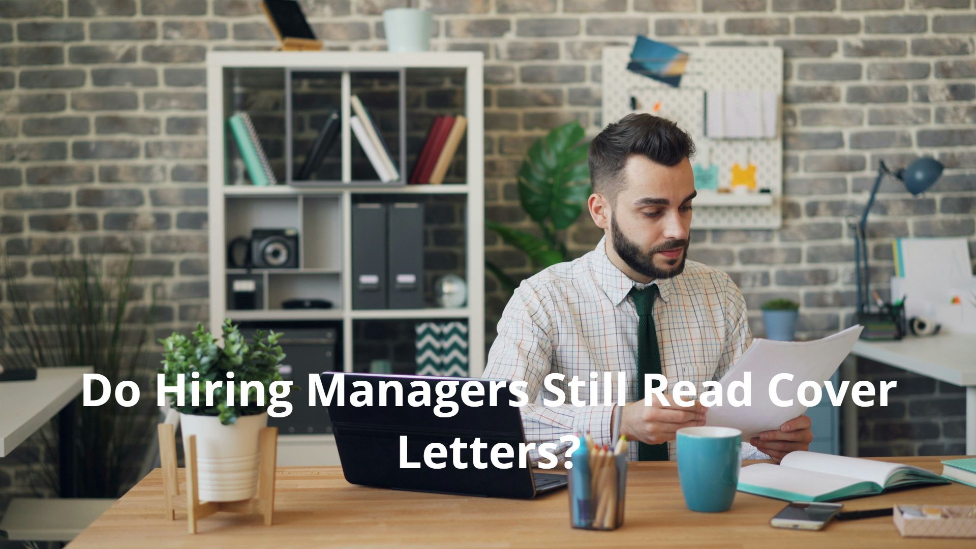 A hiring manager is sitting at a desk, reading a cover letter.