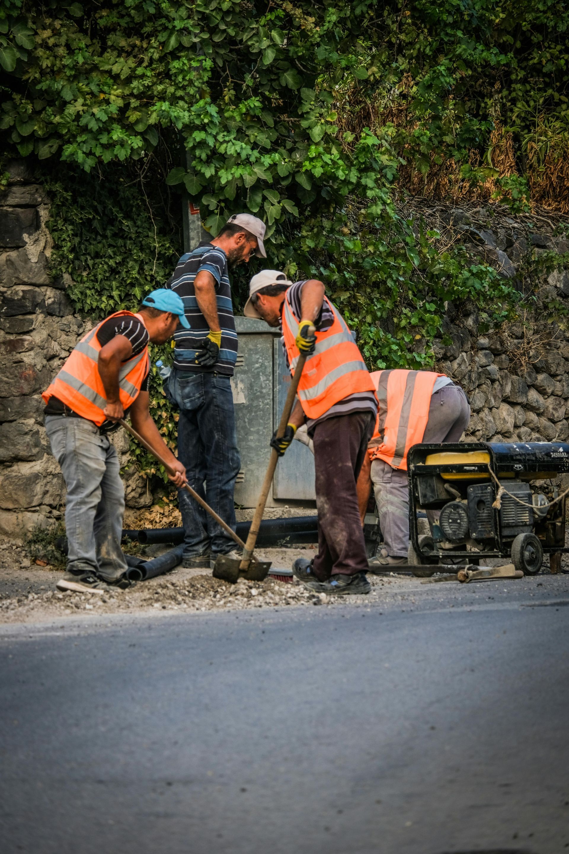 Interior view of a ceiling and wall with exposed drywall and seams, with embedded light fixtures.