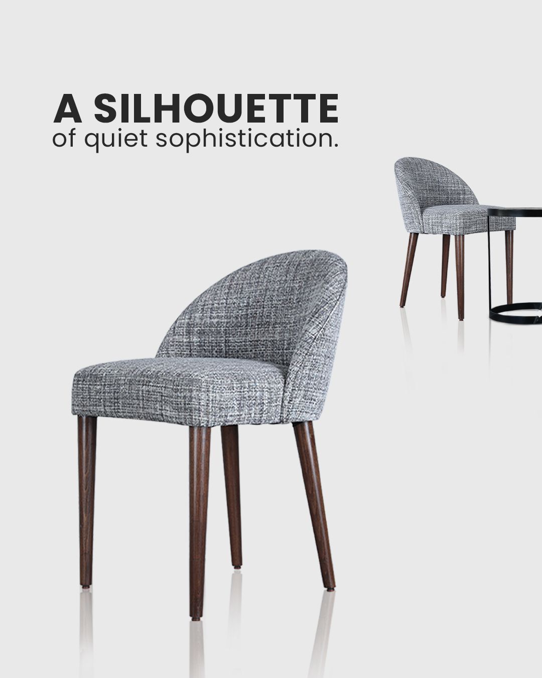 Gray upholstered chair with wood legs, shown in two angles, with text 