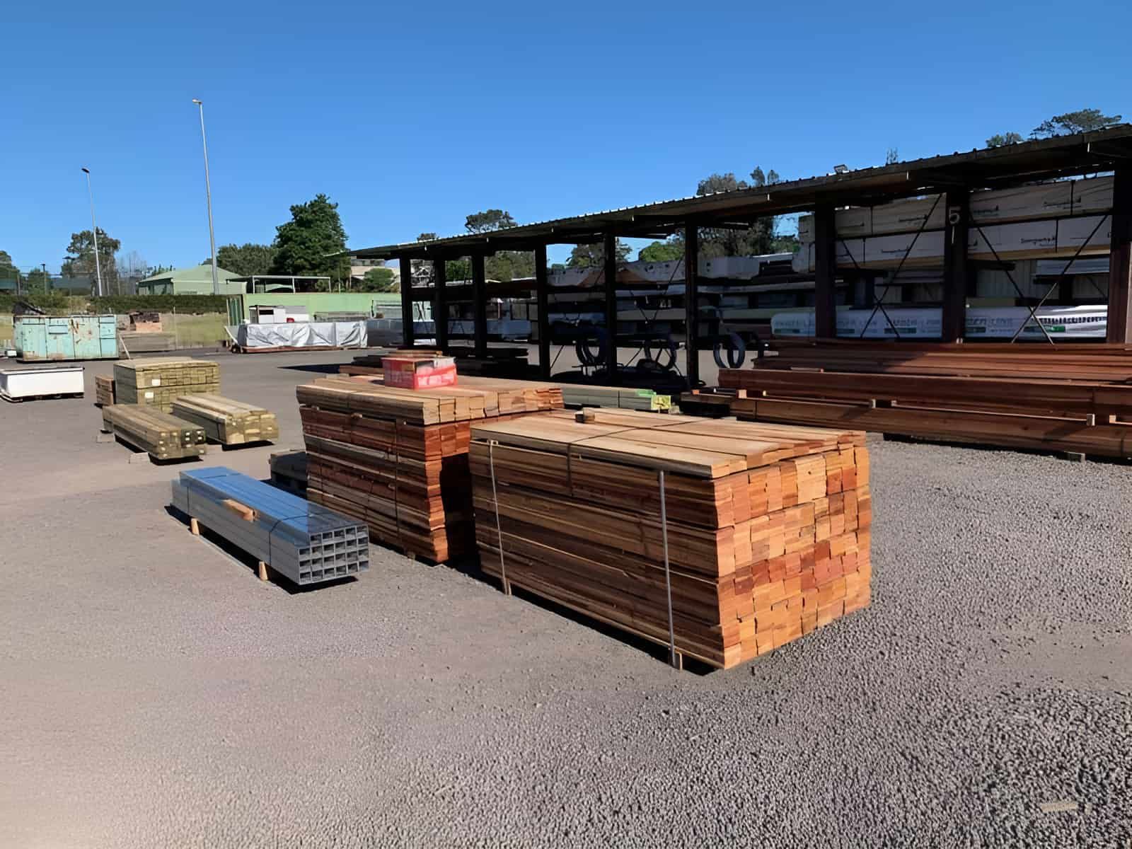 A Bunch Of Wood Stacked On Top Of Each Other In A Yard — Perry's Timber & Fencing In Dapto, NSW