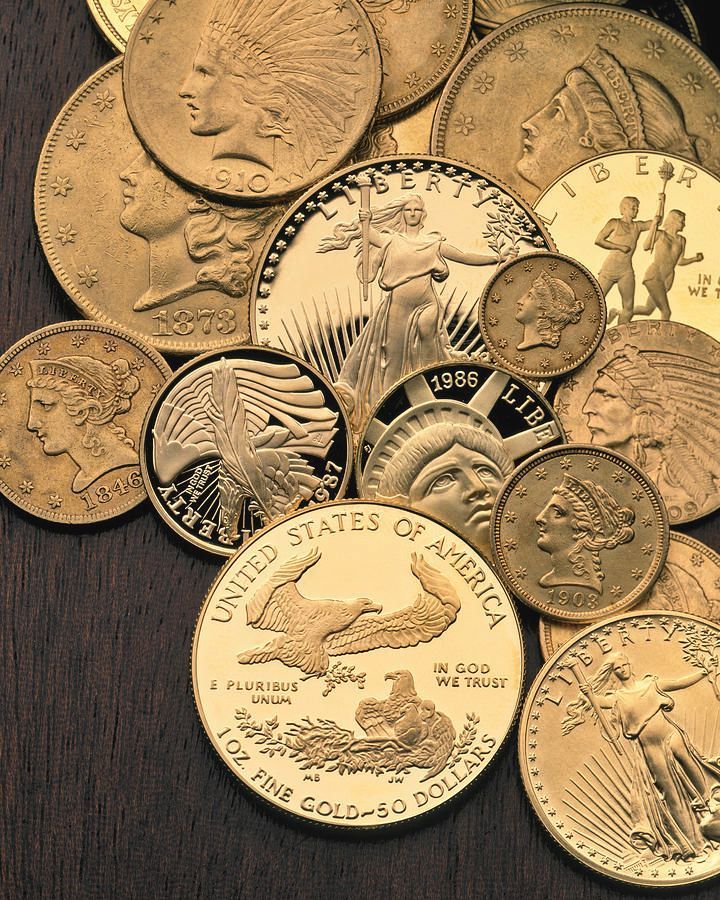 Pile of various gold coins.