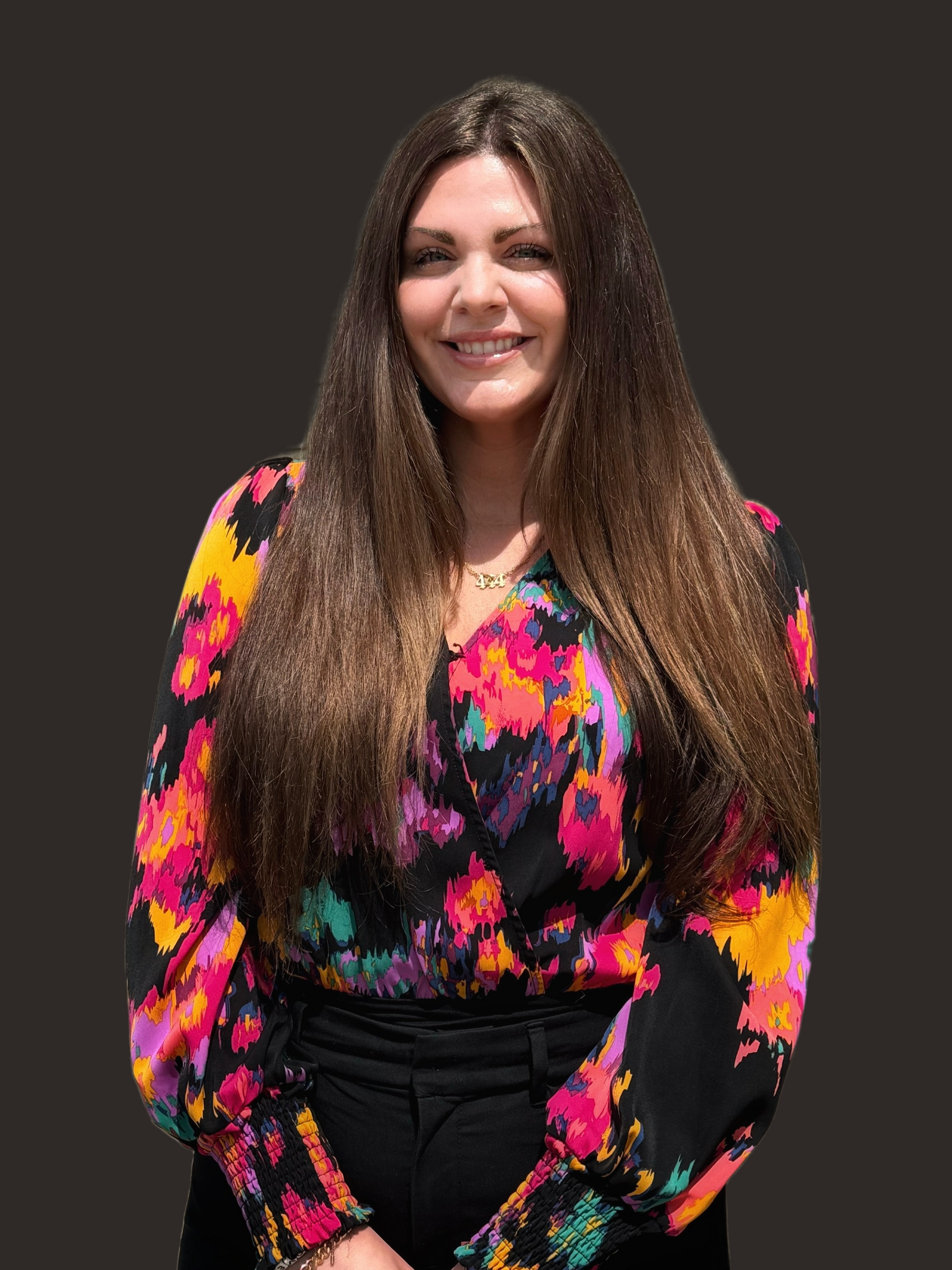 Stone path across a calm lake, surrounded by colorful autumn trees reflecting in the water.
