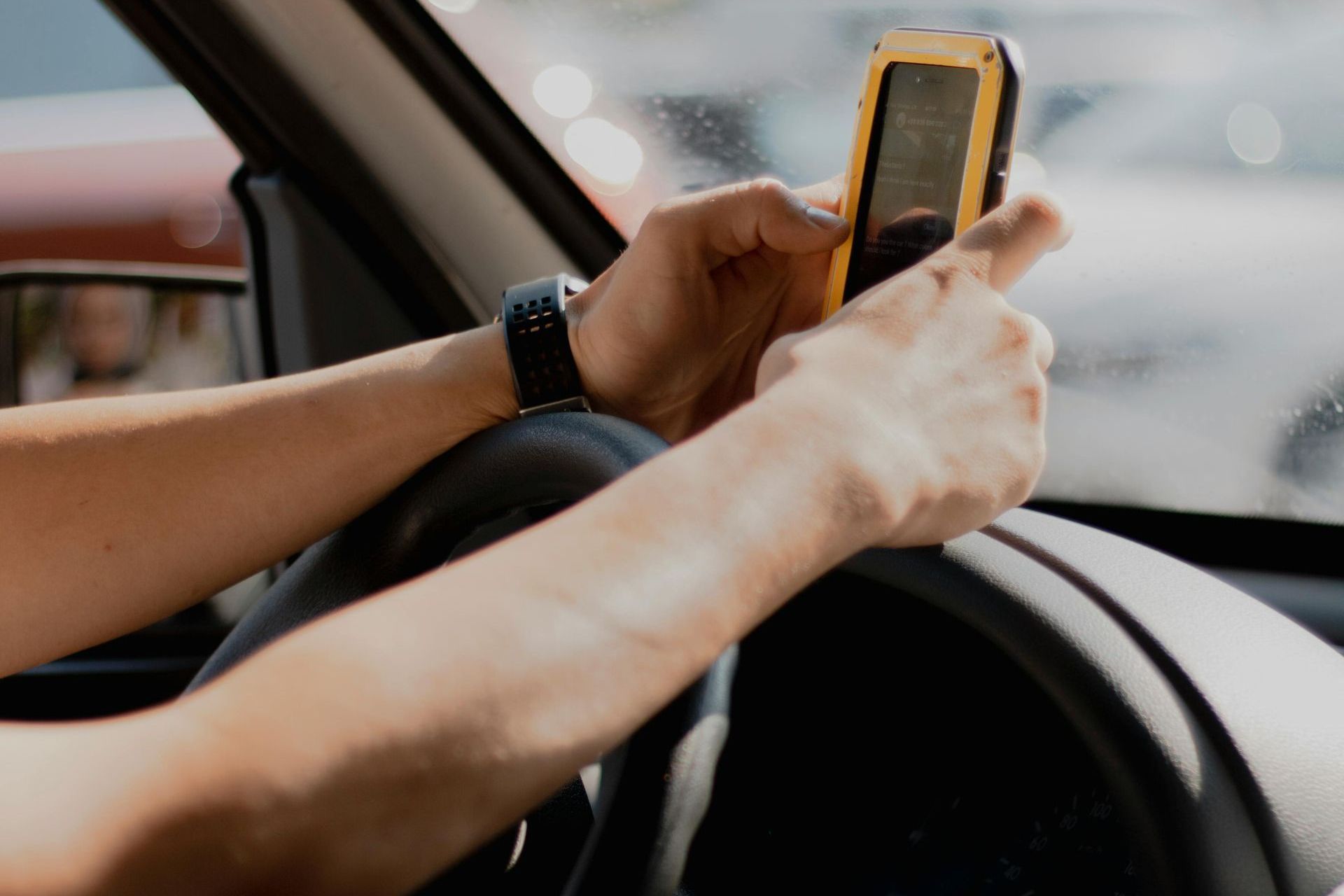 image of a man holding a phone