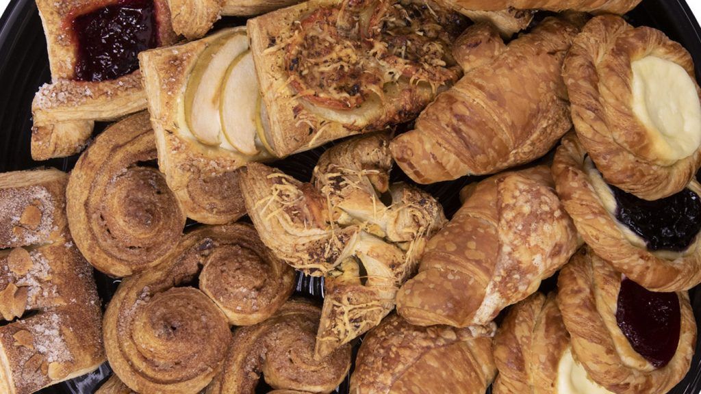 There are many different types of pastries on the plate.