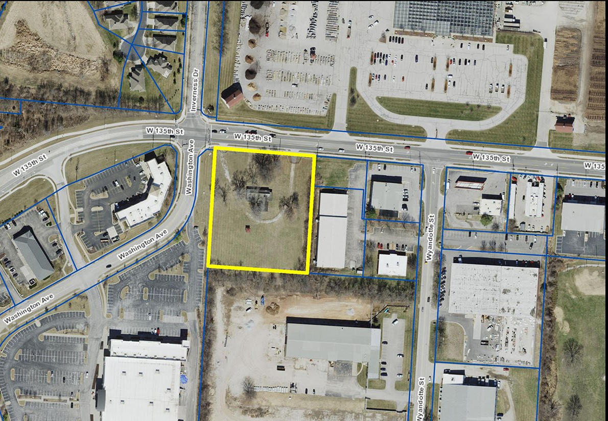 An aerial view of a residential area with a yellow outline around the area