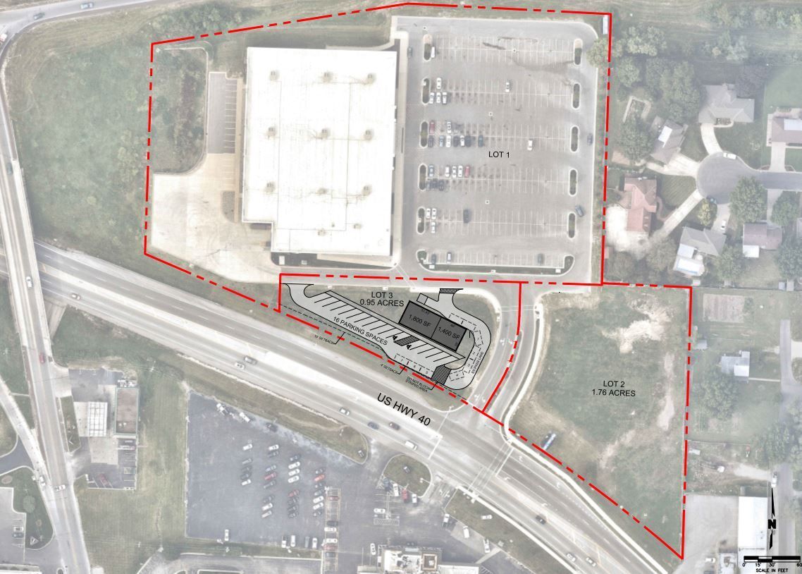 An aerial view of a building with a red line around it