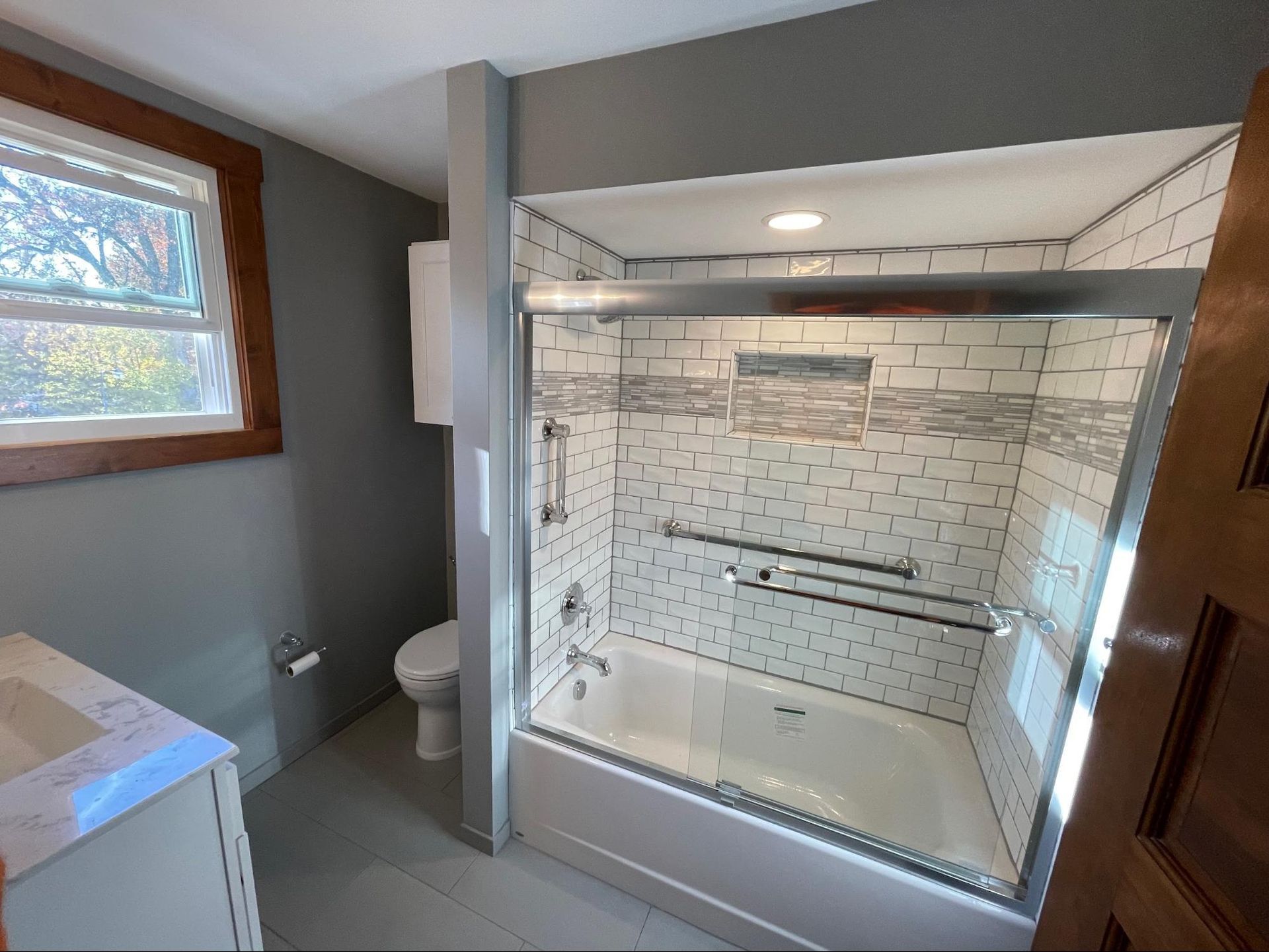 a bathroom with a bathtub and a toilet