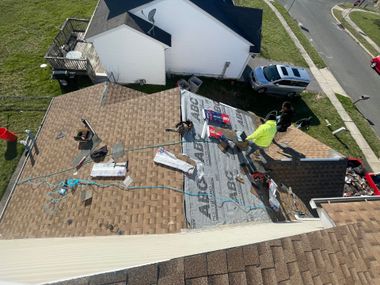 a roof with abc shingles being installed on it