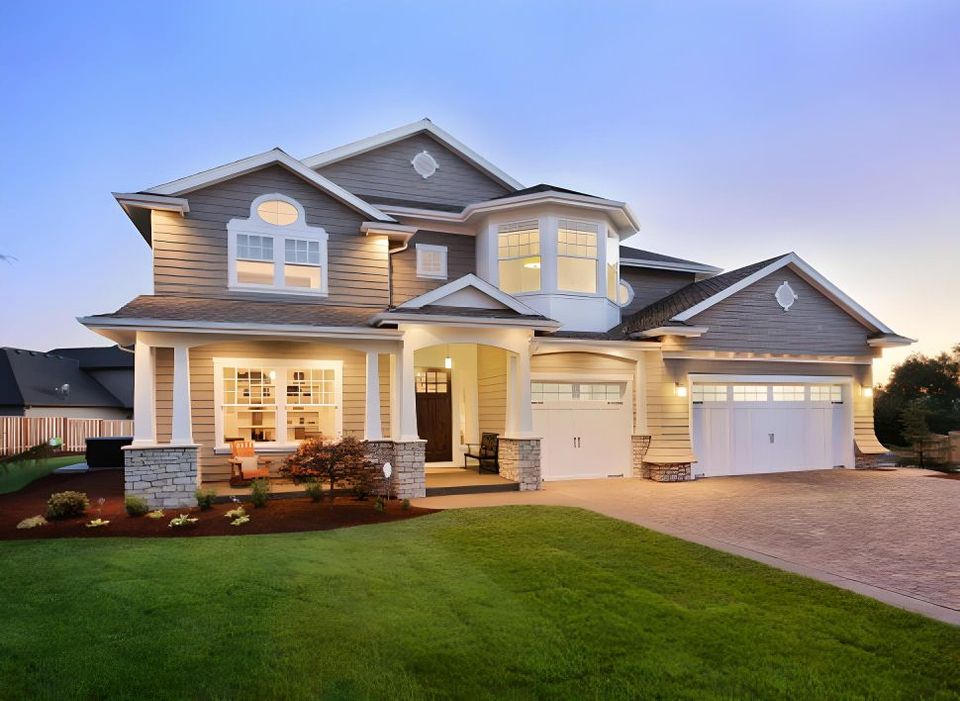 a large house with a white garage door