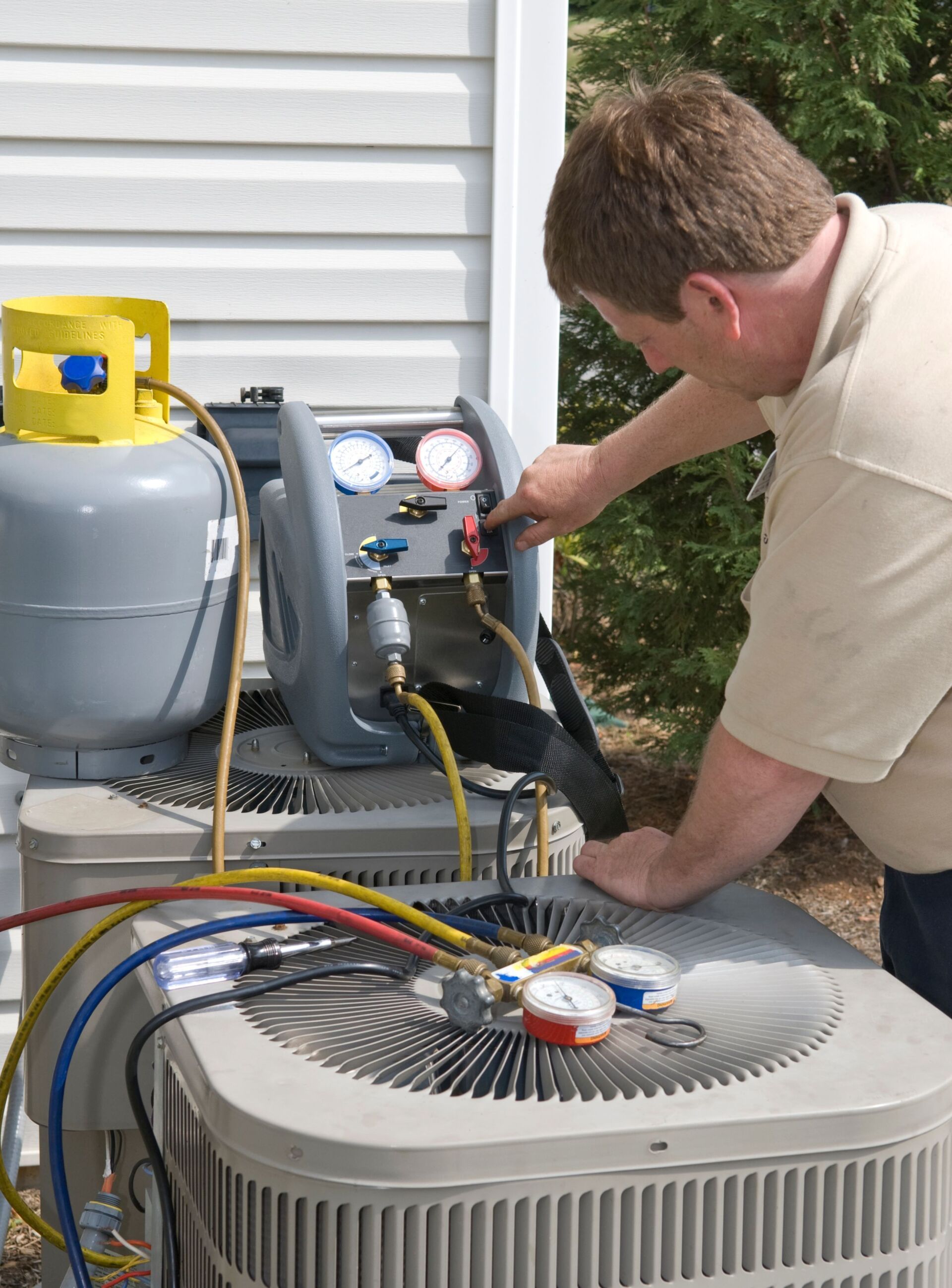 Technician Repairing Air Conditioner - Conroe, TX - Diamond Heating & Air Conditioning