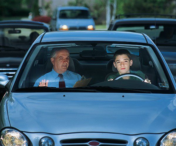 Contact Driving Instructors — Student Driver With Instructor Inside Car in Mine Hill, NJ Contact Driving Instructors — Student Driver With Instructor Inside Car in Mine Hill, NJ