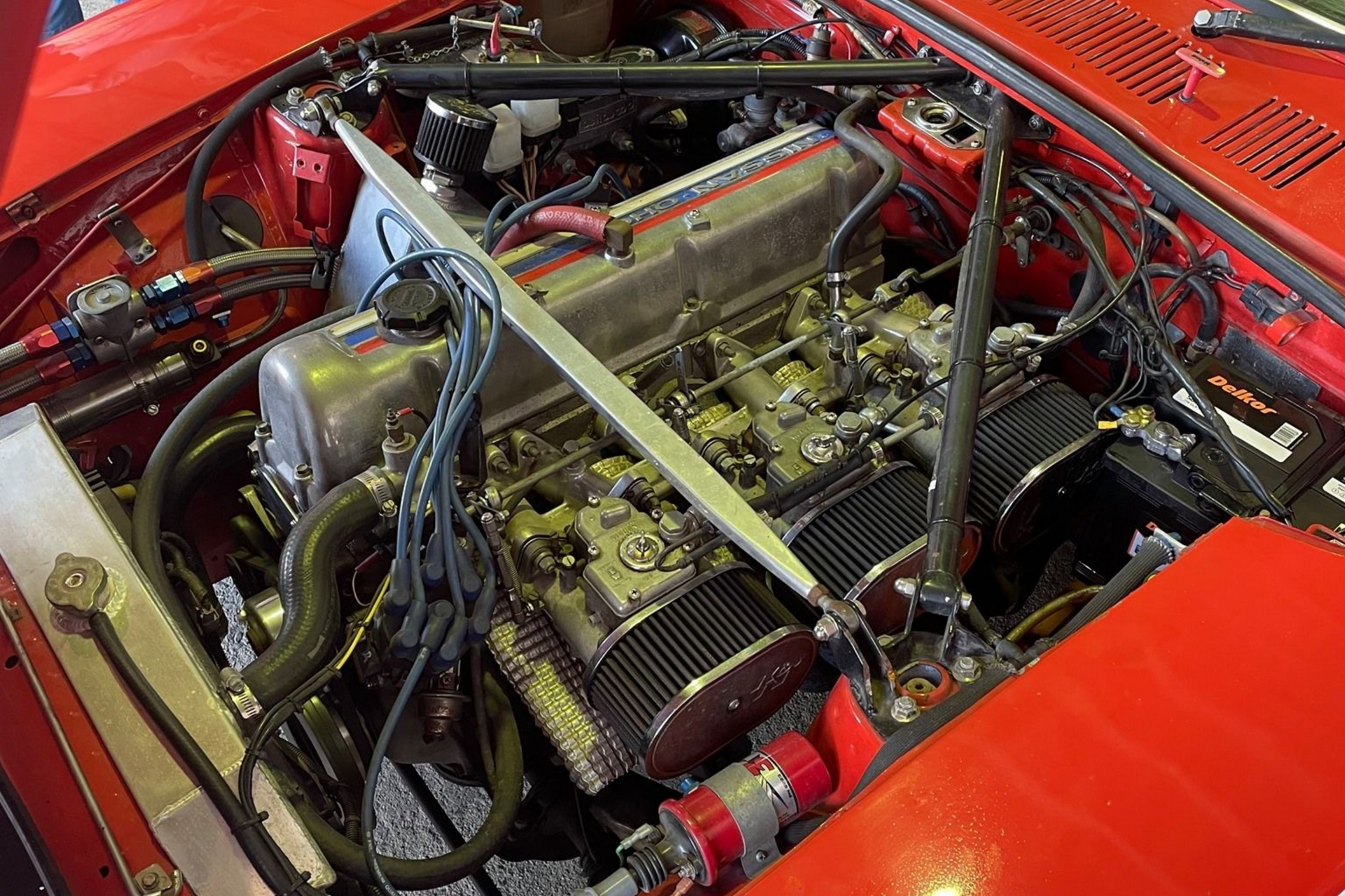 Open Engine Of A Red Car