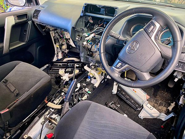 the Interior of a Toyota Car is Being Dismantled — Cairns Auto Electrical Mechanical Air & Audio in Stratford, QLD