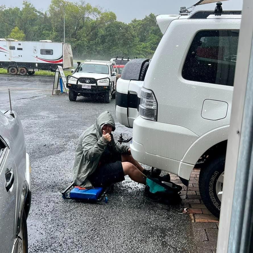 Servicing A White Vehicle While Raining